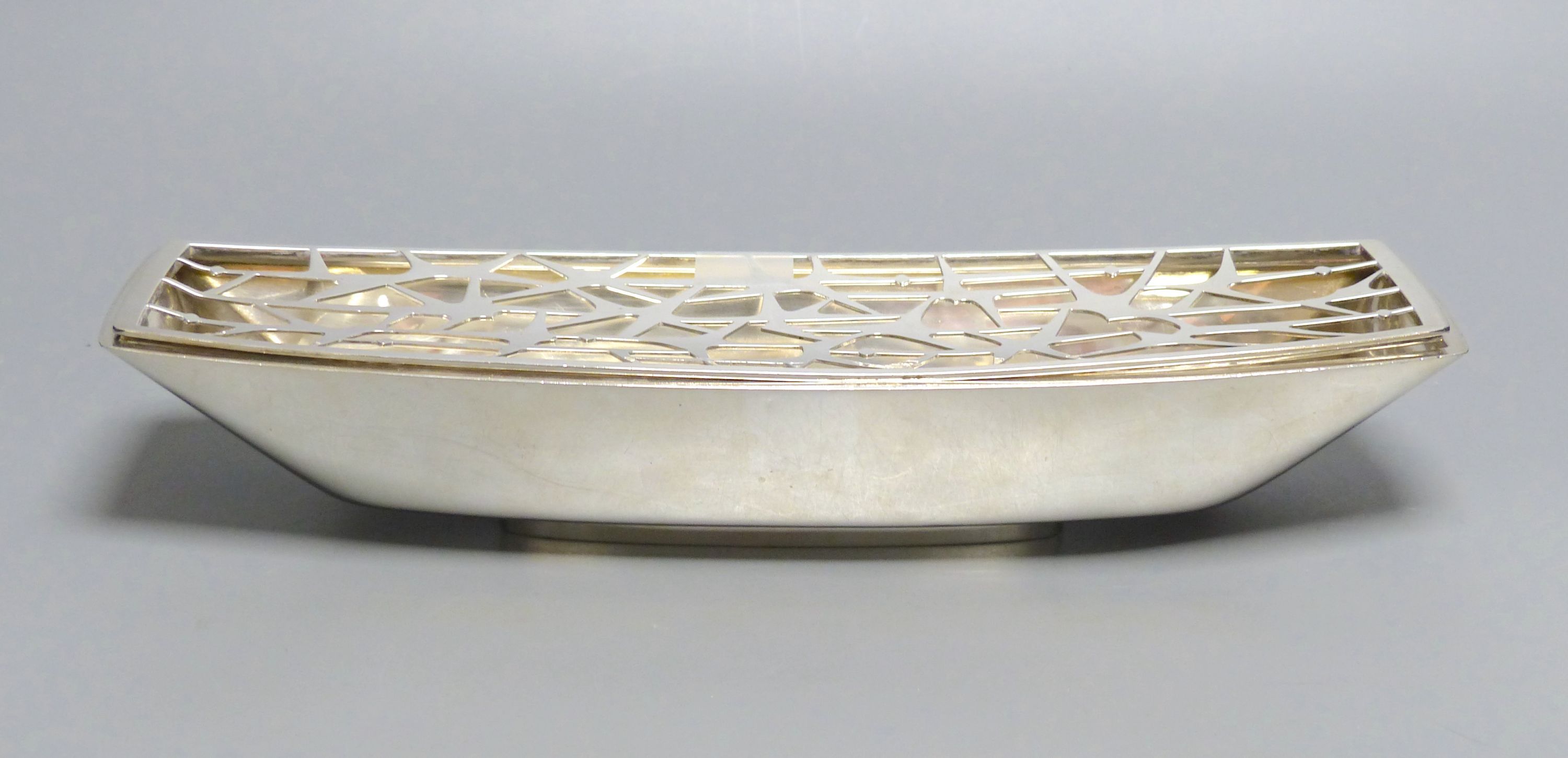 A. G. Styles for Garrard & Co, an unusual silver boat-shaped presentation flower trough, 28.94oz